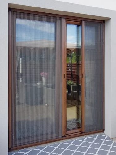 Pleated net on a wooden framed door